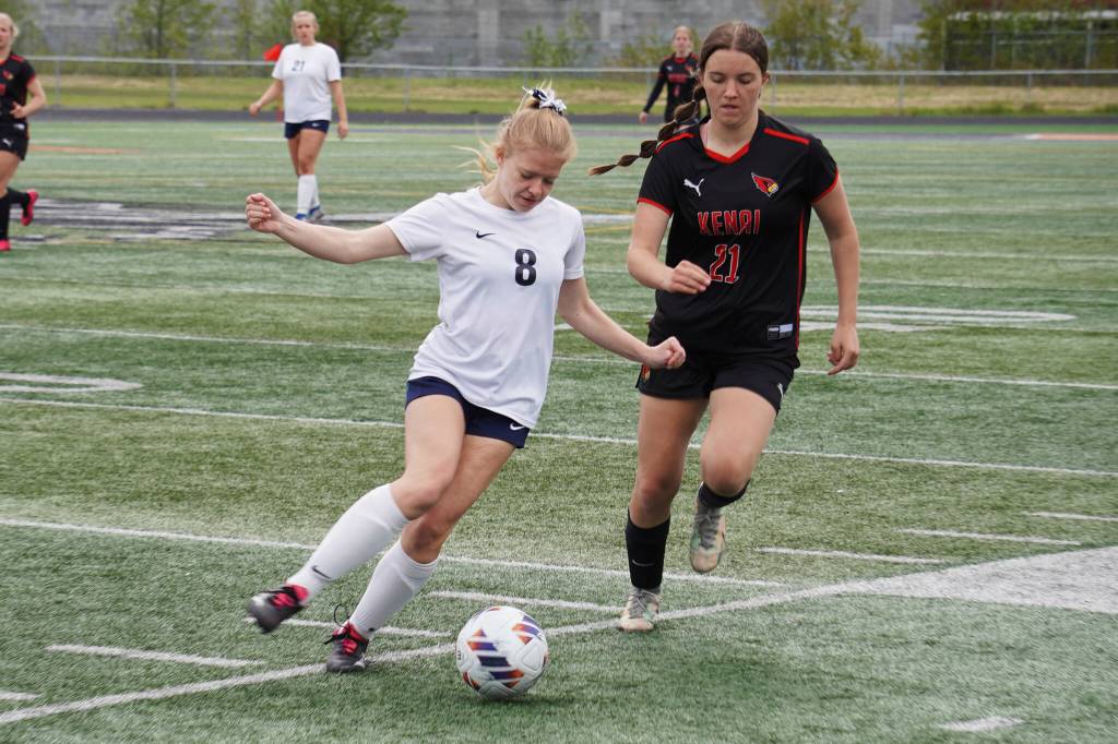Soldotnas Keely Sundberg battles for the ball with Kenai Centrals Ella Yragui during the Division II Soccer State Championship on Saturday, May 27, 2023, at West Anchorage High School in Anchorage, Alaska. (Jake Dye/Peninsula Clarion)