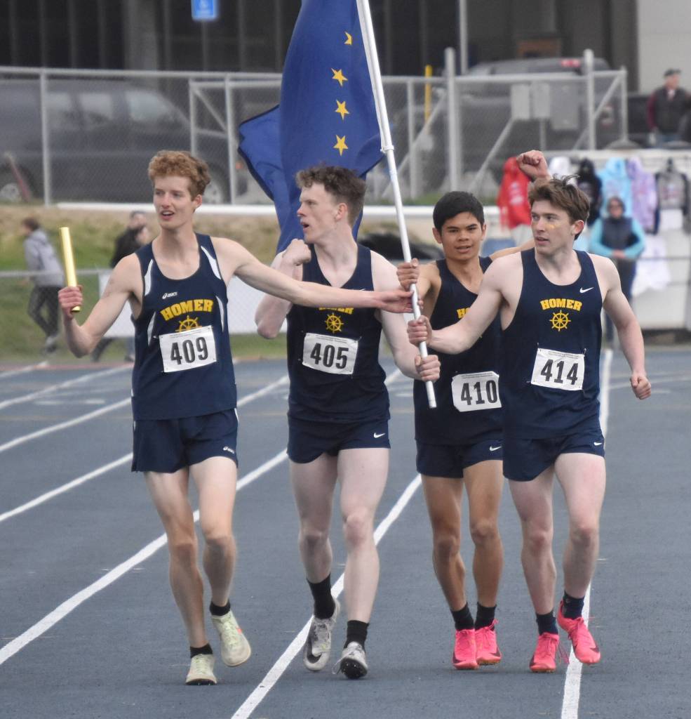 Homers Seamus McDonough, Lukyan Dax, Jonah Mershon and Lance Seneff celebrate winning the Division II 1,600-meter relay Saturday, May 27, 2023, at the state track and field meet at Palmer High School in Palmer, Alaska. (Photo by Jeff Helminiak/Peninsula Clarion)