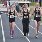 Homers Eryn Field, Gracie Miotke, Brightly Thoning and Beatrix McDonough celebrate winning the Division II 1,600-meter relay Saturday, May 27, 2023, at the state track and field meet at Palmer High School in Palmer, Alaska. (Photo by Jeff Helminiak/Peninsula Clarion)