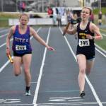 Homers Eryn Field holds off Sitkas Clare Mullin to win the Division II 1,600-meter relay Saturday, May 27, 2023, at the state track and field meet at Palmer High School in Palmer, Alaska. (Photo by Jeff Helminiak/Peninsula Clarion)