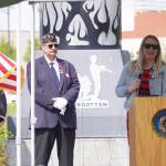 American Legion Post 20 Past Cmdr. David Segura stands as Jill Schaefer speaks on behalf of Gov. Mike Dunleavy during a Memorial Day ceremony on Monday, May 29, 2023, at Leif Hanson Memorial Park in Kenai, Alaska. (Jake Dye/Peninsula Clarion)