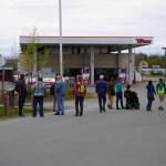 A cohort of transportation professionals splits into parties and begins a tour of the Sterling Highway and Birch Avenue intersection in Soldotna, Alaska, on Monday, May 22, 2023. (Jake Dye/Peninsula Clarion)