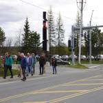 Soldotna Director of Economic Development and Planning John Czarnezki leads a party of transportation professionals on a tour of the Sterling Highway and Birch Avenue intersection in Soldotna, Alaska, on Monday, May 22, 2023. (Jake Dye/Peninsula Clarion)