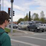 Orion LeCroy, a member of the state Department of Transportation, tours the Sterling Highway and Birch Avenue intersection in Soldotna, Alaska, on Monday, May 22, 2023. (Jake Dye/Peninsula Clarion)