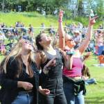 People gather in Ninilchik Aug. 5, 2022, for Salmonfest, an annual event that raises awareness about salmon-related causes. (Camille Botello/Peninsula Clarion)