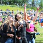 People gather in Ninilchik, Alaska, on Friday, August 5, 2022 for Salmonfest, an annual event that raises awareness about salmon-related causes. (Camille Botello/Peninsula Clarion)