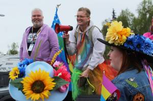 David Brighton (left) and Leslie Byrd (right) prepare to lead marchers from the Soldotna Regional Sports Complex to Soldotna Creek Park as part of Soldotna Pride in the Park on Saturday, June 3, 2023 in Soldotna, Alaska. (Ashlyn OHara/Peninsula Clarion)