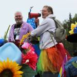 David Brighton (left) and Leslie Byrd (right) prepare to lead marchers from the Soldotna Regional Sports Complex to Soldotna Creek Park as part of Soldotna Pride in the Park on Saturday, June 3, 2023 in Soldotna, Alaska. (Ashlyn OHara/Peninsula Clarion)