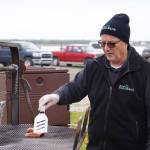 Kenai Peninsula Food Bank Executive Director Greg Meyer grills salmon at Return of the Reds on Saturday, June 3, 2023, at the Kenai City Dock in Kenai, Alaska. (Jake Dye/Peninsula Clarion)