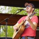 Tyson Davis performs as part of Blackwater Railroad Company during the Levitt AMP Soldotna Music Series on Wednesday, June 7, 2023, at Soldotna Creek Park in Soldotna, Alaska. (Jake Dye/Peninsula Clarion)