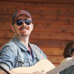 Tyson Davis performs as part of Blackwater Railroad Company during the Levitt AMP Soldotna Music Series on Wednesday, June 7, 2023, at Soldotna Creek Park in Soldotna, Alaska. (Jake Dye/Peninsula Clarion)