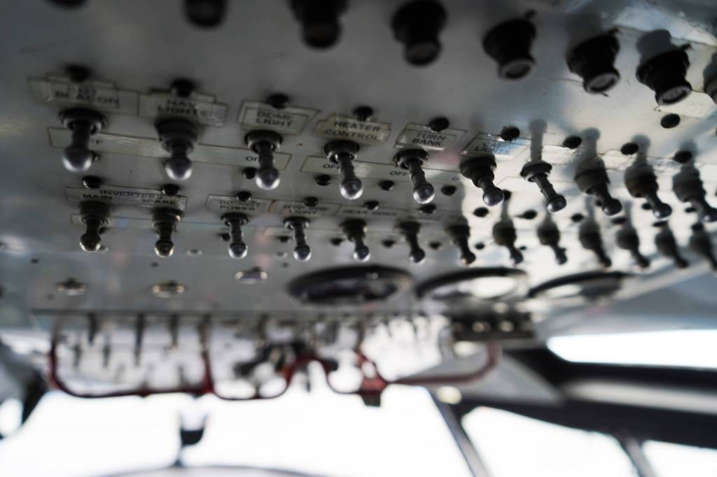 Aged controls are seen inside a large plane displayed at the Kenai Peninsula Air Fair on Saturday, June 10, 2023, at the Kenai Municipal Airport in Kenai, Alaska. (Jake Dye/Peninsula Clarion)