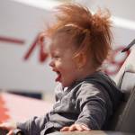 A child sits inside a plane displayed at the Kenai Peninsula Air Fair on Saturday, June 10, 2023, at the Kenai Municipal Airport in Kenai, Alaska. (Jake Dye/Peninsula Clarion)