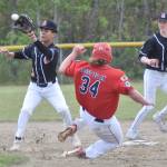 Charlie Chamberlain of the American Legion Twins beats the tag of West second baseman Orion Halliburton on Sunday, June 11, 2023, at the Soldotna Little League fields in Soldotna, Alaska. (Photo by Jeff Helminiak/Peninsula Clarion)