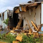Building materials pile up at the site of the former ZipMart on Wednesday, June 14, 2023, in Sterling, Alaska. (Ashlyn OHara/Peninsula Clarion)