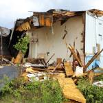 Building materials pile up at the site of the former ZipMart on Wednesday, June 14, 2023 in Sterling, Alaska. (Ashlyn OHara/Peninsula Clarion)