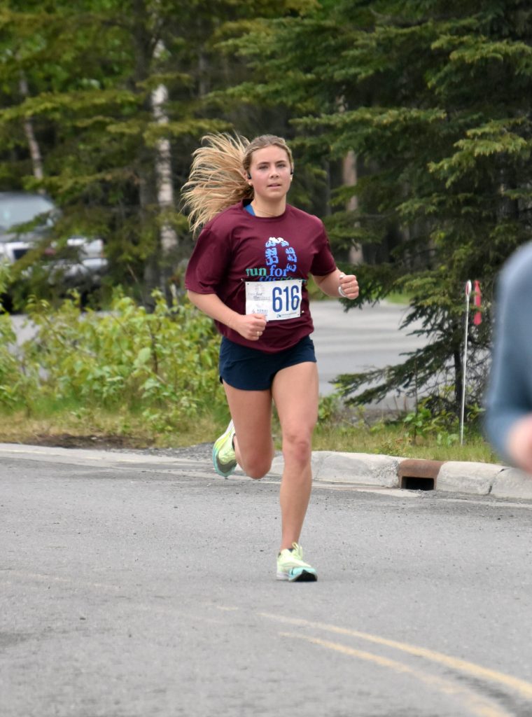 Jordan Strausbaugh runs to victory in the 10-mile event at the Run for the River on Saturday, June 10, 2023, in Soldotna, Alaska. (Photo by Jeff Helminiak/Peninsula Clarion)