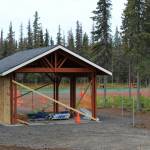 A pavillion under construction marks the entrance to the future Kenai Dog Park on Wednesday, June 14, 2023, in Kenai, Alaska. (Ashlyn OHara/Peninsula Clarion)