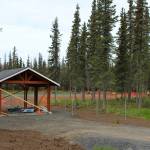 A pavillion under construction marks the entrance to the future Kenai Dog Park on Wednesday, June 14, 2023, in Kenai, Alaska. (Ashlyn OHara/Peninsula Clarion)