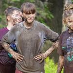 Contestants line up as judges decide who will be The Muddiest at the conclusion of the KDLL Mud Run at Tsalteshi Trails in Soldotna, Alaska, on Friday, June 16, 2023. (Jake Dye/Peninsula Clarion)