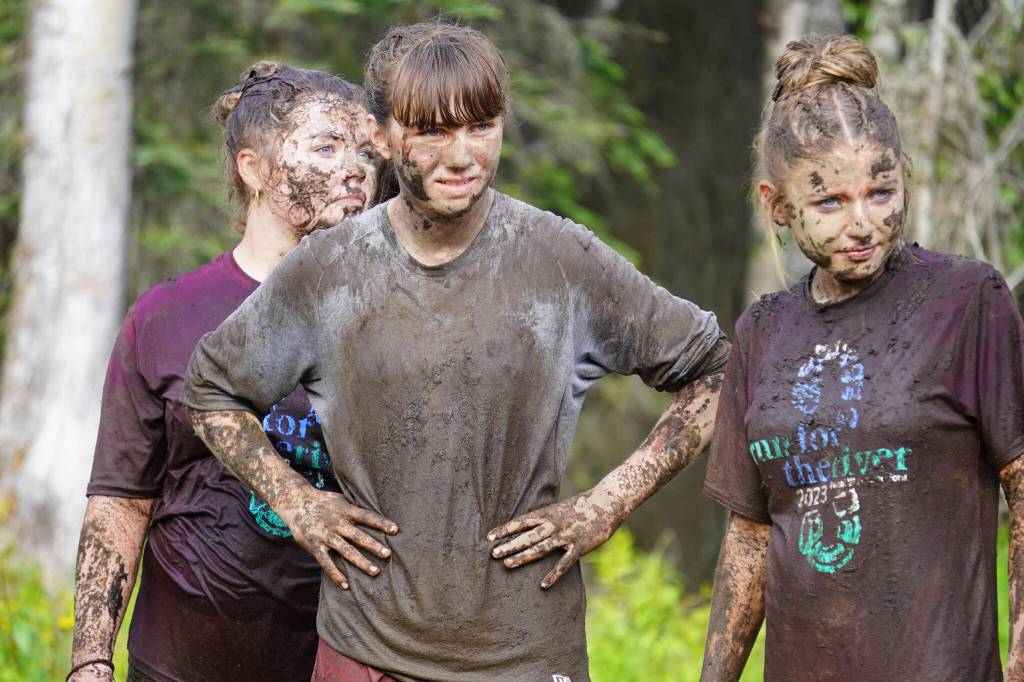 Contestants line up as judges decide who will be The Muddiest at the conclusion of the KDLL Mud Run at Tsalteshi Trails in Soldotna, Alaska, on Friday, June 16, 2023. (Jake Dye/Peninsula Clarion)