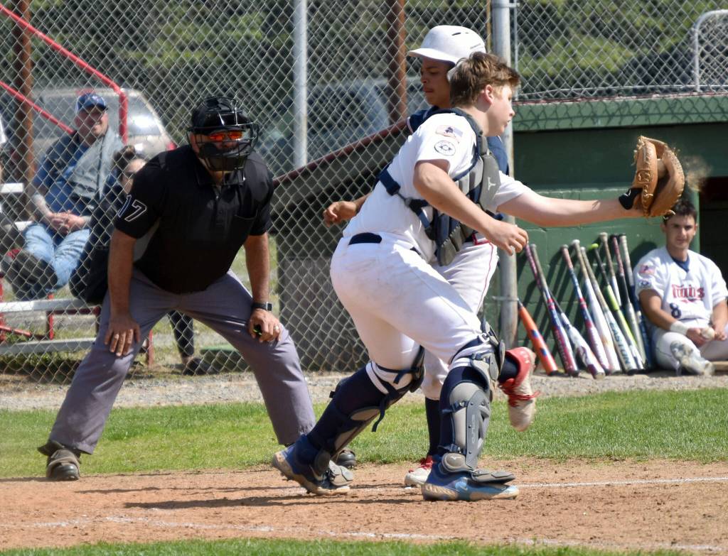 Wasilla Road Warriors Matthew Vandenberg beats the tag of American Legion Twins catcher Jayden Stuyvesant on Sunday, June 18, 2023, at Coral Seymour Memorial Park in Kenai, Alaska. (Photo by Jeff Helminiak/Peninsula Clarion)