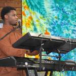 Donte Powell, part of Wasabi Black, performs during the Soldotna Music Series at Soldotna Creek Park in Soldotna, Alaska, on Wednesday, June 21, 2023. (Jake Dye/Peninsula Clarion)