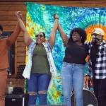 The members of Wasabi Black stand and bow at the end of their set during the Soldotna Music Series at Soldotna Creek Park in Soldotna, Alaska, on Wednesday, June 21, 2023. (Jake Dye/Peninsula Clarion)