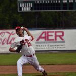 Peninsula OIlers starter Arnad Mulamekic delivers the first pitch of the Oilers home schedule at Coral Seymour Memorial Park in Kenai, Alaska, on Wednesday, June 21, 2023. (Photo by Jeff Helminiak/Peninsula Clarion)