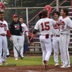 Peninsula Oilers catcher Ben Griffin celebrates his first inning homer with Theo Forshey on Wednesday, June 22, 2023, at Coral Seymour Memorial Park in Kenai, Alaska. (Photo by Jeff Helminiak/Peninsula Clarion)