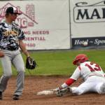Peninsula Oilers Leighton Helfrick slides in front of Bucs shortsthop Logan Hokuf on Wednesday, June 21, 2023, at Coral Seymour Memorial Park in Kenai. Helfricks effort did not result in a stolen base because the base was already his due to a walk. (Photo by Jeff Helminiak/Peninsula Clarion)