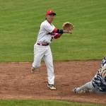 Peninsula Oilers second baseman Ryson Ujimori turns a double play in front of Anchorage Bucs Jaxon Sorenson on Wednesday, June 21, 2023, at Coral Seymour Memorial Park in Kenai, Alaska. (Photo by Jeff Helminiak/Peninsula Clarion)