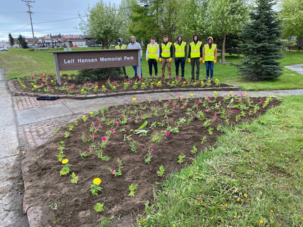 The interns working with Salamatof Tribe Duhdeldiht Youth Services stand with flowers they helped to plant in Leif Hansen Memorial Park (Photo courtesy Michael Bernard)