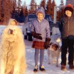 The Fenger children (Peter, at left, behind the dog, Heidi and Eric) pose near their home on the Homer bluff near the airport. Their dogs were Hartford (L) and Flojo.