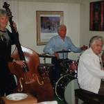 Dr. John Fenger (seated in back at the drums) was a passionate purveyor of jazz music. Here, circa 1990, he practices with the two other members of the Palm Canyon Jazz Lite Trio in Arizona.