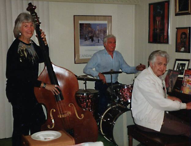 Dr. John Fenger (seated in back at the drums) was a passionate purveyor of jazz music. Here, circa 1990, he practices with the two other members of the Palm Canyon Jazz Lite Trio in Arizona.