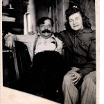Charles Windy Wagner, in his later years, and an unknown woman smile for the camera in Wagners Kenai River cabin. (Photo courtesy of the Knackstedt Collection)