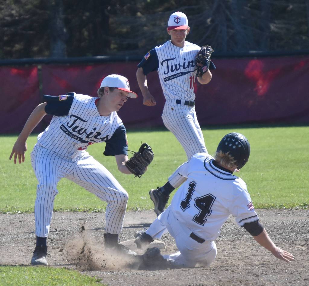 Legion Twins second baseman Andrew Pieh tags out Kolten Lindstrom of the Lower Columbia (Washington) Baseball Club on Saturday, July 1, 2023, at the Kenai Little League fields in Kenai, Alaska. (Photo by Jeff Helminiak/Peninsula Clarion)