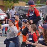Soldotna Little League players call out to attendees as the Fourth of July Parade moves down the Kenai Spur Highway in Kenai, Alaska on Tuesday, July 4, 2023. (Jake Dye/Peninsula Clarion)