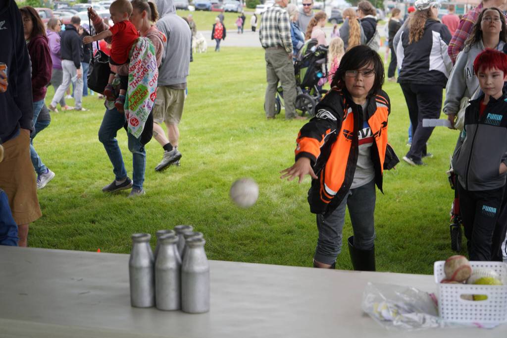 Carnival games are played at the softball greenstrip in Kenai, Alaska, on Tuesday, July 4, 2023. (Jake Dye/Peninsula Clarion)