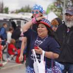 Representatives of Aspen Creek Senior Living turn onto the Kenai Spur Highway in Kenai, Alaska, during the Fourth of July Parade on Tuesday, July 4, 2023. (Jake Dye/Peninsula Clarion)
