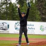 Lisa Parker, vice mayor of Soldotna, celebrates after throwing the ceremonial first pitch before a game between the Peninsula Oilers and the Mat-Su Miners on Tuesday, July 4, 2023, at Coral Seymour Memorial Park in Kenai, Alaska. (Jake Dye/Peninsula Clarion)