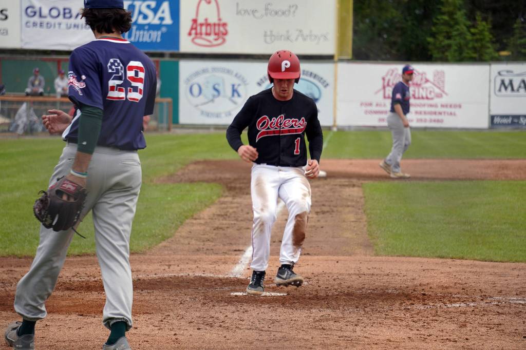 Brett Grupe arrives back at home during a game between the Peninsula Oilers and the Mat-Su Miners on Tuesday, July 4, 2023, at Coral Seymour Memorial Park in Kenai, Alaska. (Jake Dye/Peninsula Clarion)