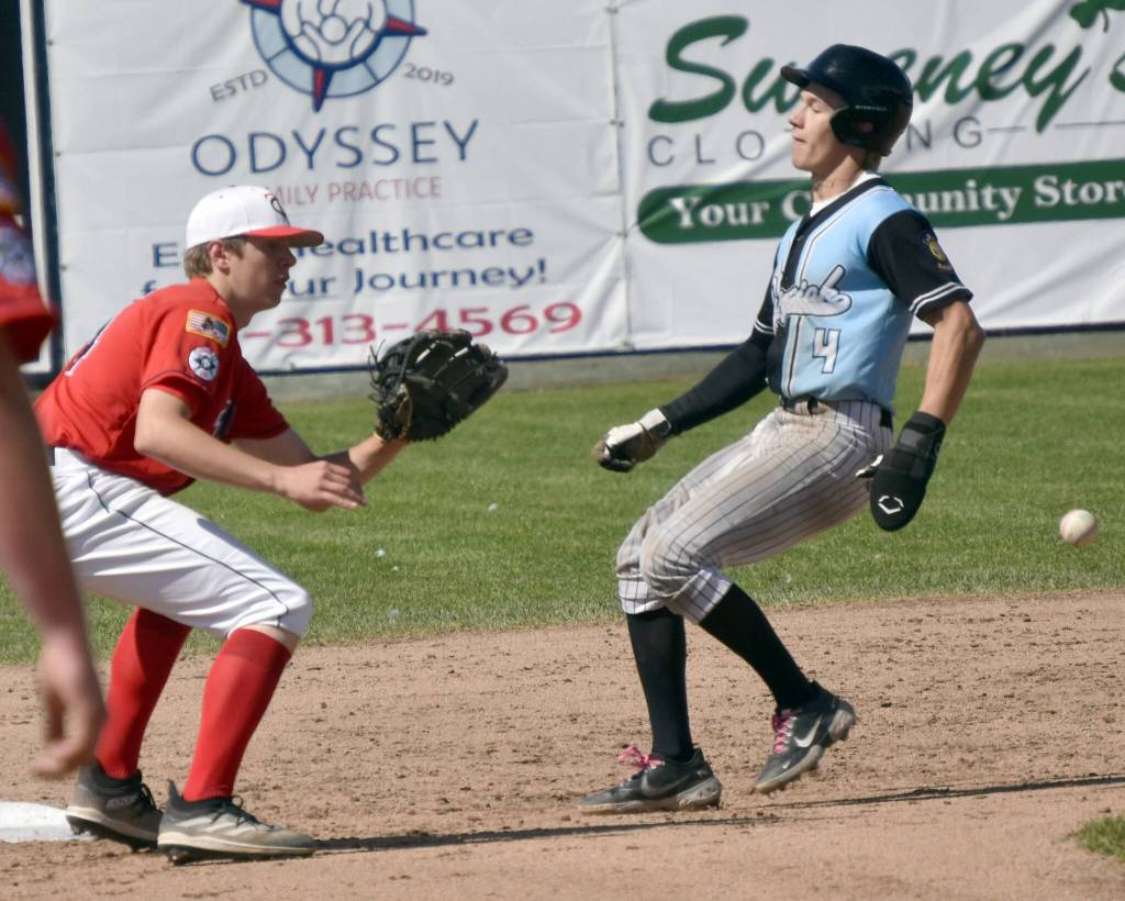 Chugiaks Fischer Sims steals second base in front of Legion Twins shortstop Andrew Pieh on Sunday, July 9, 2023, at Coral Seymour Memorial Park in Kenai, Alaska. (Photo by Jeff Helminiak/Peninsula Clarion)