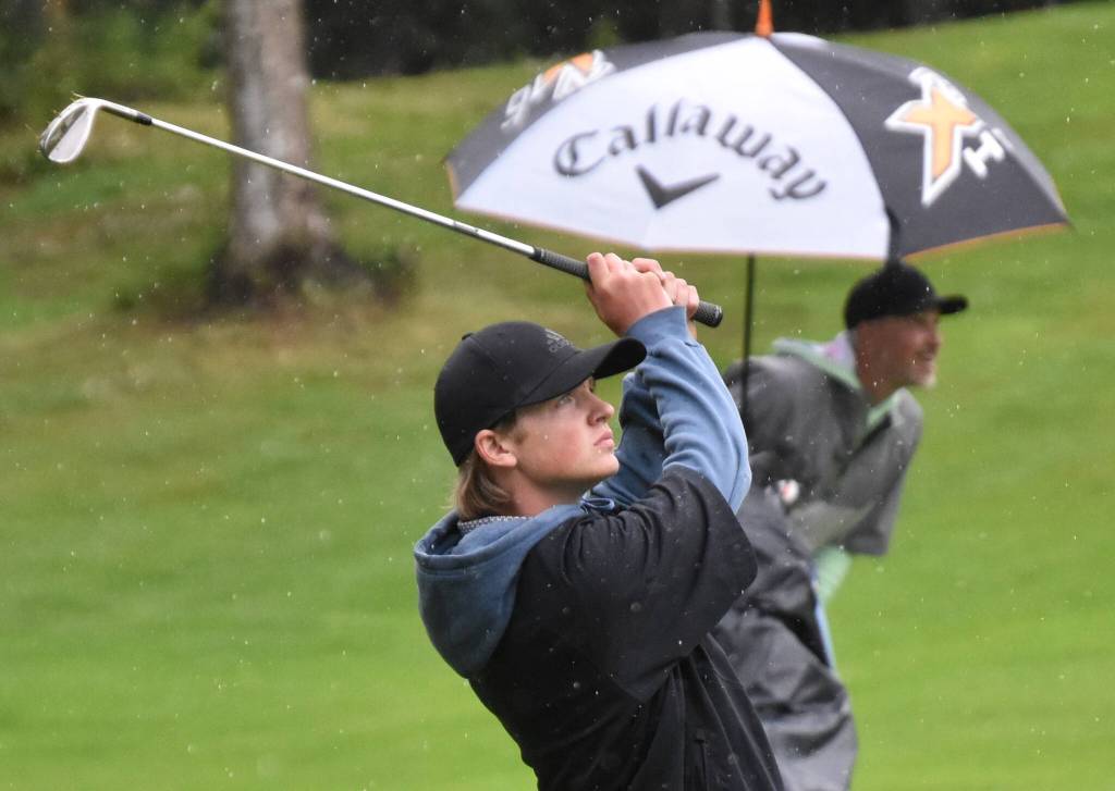 Shane Sundberg hits his approach to the No. 18 green at the Kenai Peninsula Open on Sunday, July 16, 2023, at Birch Ridge Golf Course in Soldotna, Alaska. (Photo by Jeff Helminiak/Peninsula Clarion)