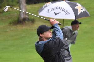 Shane Sundberg hits his approach to the No. 18 green at the Kenai Peninsula Open on Sunday, July 16, 2023, at Birch Ridge Golf Course in Soldotna, Alaska. (Photo by Jeff Helminiak/Peninsula Clarion)