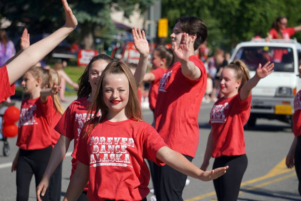 Forever Dance performers proceed down Binkley Avenue in Soldotna, Alaska, part of the Progress Days Parade on Saturday, July 22, 2023. (Jake Dye/Peninsula Clarion)
