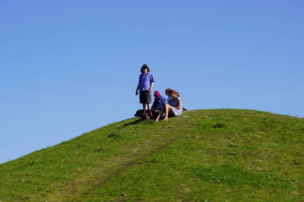 Attendees of the Progress Days Parade look down on the action from the top of the hill at Soldotna Elementary in Soldotna, Alaska, on Saturday, July 22, 2023. (Jake Dye/Peninsula Clarion)