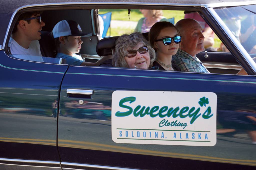Mike Sweeney, right, and others proceed down Binkley Avenue in Soldotna, Alaska, part of the Progress Days Parade on Saturday, July 22, 2023. (Jake Dye/Peninsula Clarion)
