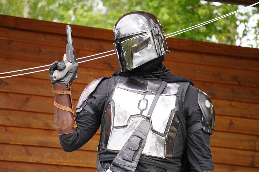 Wyatt Denna, as original Star Wars Mandalorian Dex Vizsla, participates in the Kenai Performers Cosplay Contest, part of the Progress Days Fair at Soldotna Creek Park in Soldotna, Alaska, on Friday, July 21, 2023. (Jake Dye/Peninsula Clarion)